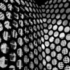 Abstract reflection pattern of a modern building in Phoenix captured through perforated metal.